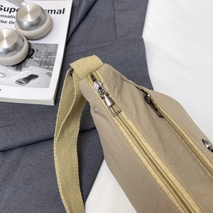 Khaki nylon crossbody bag with multi-zipper compartments for daily travel and commute