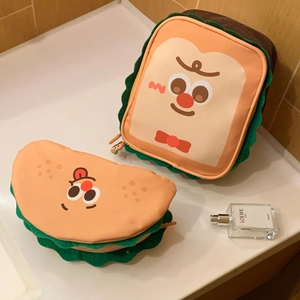 Detailed view of cute toast-shaped makeup bags with soft fabric and cartoon expressions