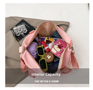 Detailed internal view of a large pink waterproof gym bag showing spacious storage capacity