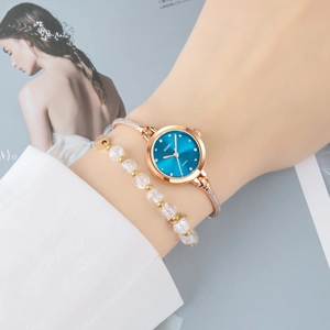 Elegante SKMEI Damen-Quarzuhr mit blauem Zifferblatt und goldenem Perlenarmband