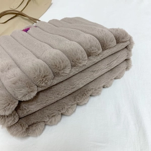 Khaki plush faux fur tote bag with vertical pleated texture and slender top handles