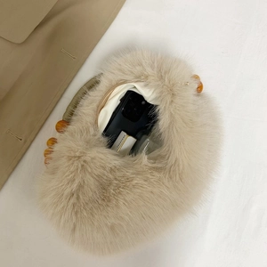 Plush faux fur dumpling bag with wooden bead handle and spacious zipper interior