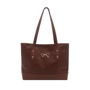 Brown faux leather tote bag with golden bow hardware and minimalist commute design