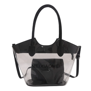 Large transparent PVC tote bag with black inner pouch and round handles on white background