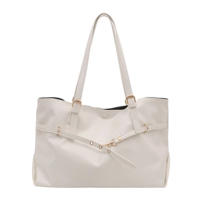 Minimalist cream white leather tote bag with gold metal buckle and long shoulder strap