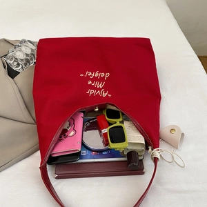 Large capacity red canvas tote bag for women showing daily items inside for storage