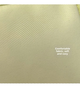 Macro detail of soft cream-colored twill fabric texture with silky finish on a shoulder bag