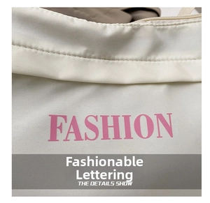 Detail of pink FASHION letter print on white canvas bag with fine stitching quality