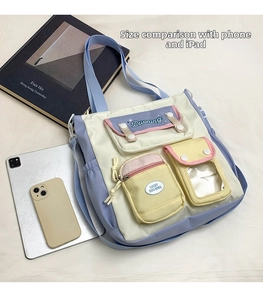 Multi-pocket canvas tote showing size comparison with iPad and smartphone
