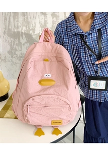 Detailed view of pink duck-shaped nylon backpack with 3D beak and embroidery