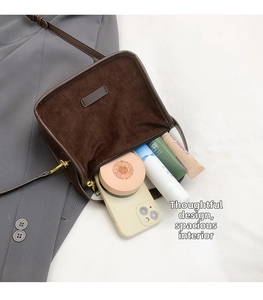 Detailed interior of leopard print crossbody bag showing large capacity for cosmetics