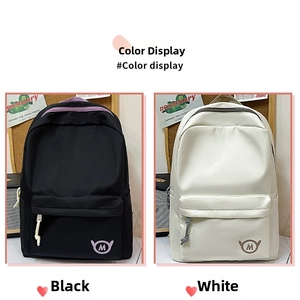 Minimalist nylon backpacks in black and cream featuring front zip pockets and side pockets