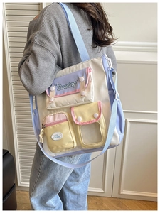 Close-up of a pastel patchwork canvas tote bag with functional pockets and clear slot