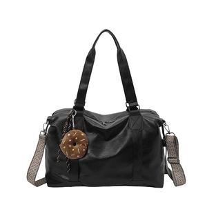Retro black PU leather tote bag with woven shoulder strap and brown donut pendant