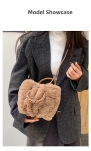 Brown plush faux fur cloud bag with woven handle shown on model as a crossbody style