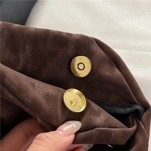 Brown velvet envelope clutch with gold magnetic snap closure and textured rivets