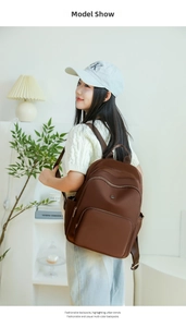 Brown large capacity backpack for women shown in lifestyle setting for commuting
