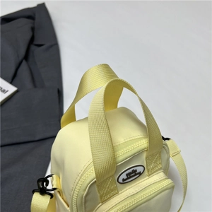 Cute lemon yellow canvas mini bag with dual handles and front pocket for women