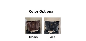 Detail view of large tote bags in brown and black leather with metallic logo and long straps