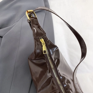 Retro deep brown glossy faux leather shoulder bag with elegant golden hardware details