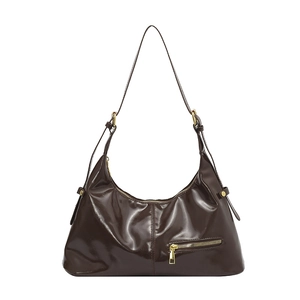 Dark brown high-gloss leather hobo bag with gold hardware and adjustable shoulder strap