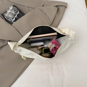 Creamy white large capacity crossbody dumpling bag showing spacious interior storage