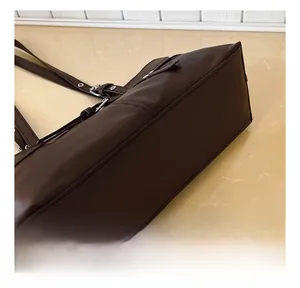 Detailed view of the reinforced stitching and durable leather texture on a tote bag