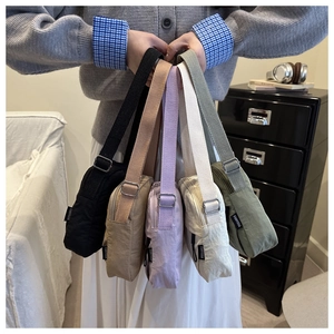 Detailed collection of colorful nylon crossbody bags with adjustable straps and brand labels