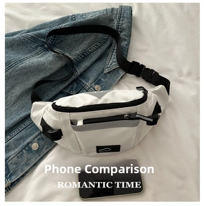 Detail view of white nylon chest bag featuring black zippers and reflective safety strips