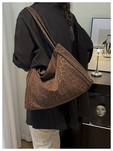 Detail of leopard print tote bag in soft faux suede with spacious single shoulder design
