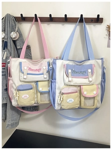 Detail view of multi-pocket canvas tote bags with adjustable straps in a school style
