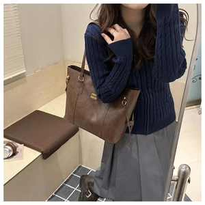 Brown faux leather tote bag with gold logo and large capacity for autumn/winter casual use
