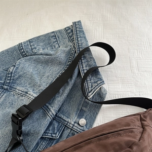 Brown faux suede waist bag paired with denim jacket for a casual autumn style