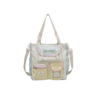 Pastel colorblock canvas tote bag with multiple front pockets and crossbody strap
