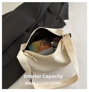 Detailed interior view of a beige nylon crossbody bag showing its large storage capacity