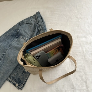 Large beige corduroy tote bag for women showing spacious interior with tablet and umbrella