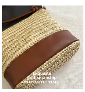 Detail of hand-woven straw and brown leather stitching with precise seam lines