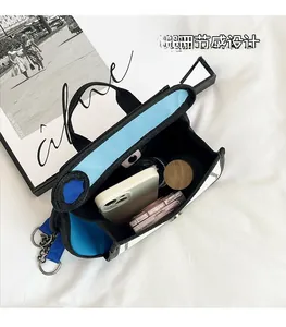 Internal view of cartoon canvas bag showing spacious storage for phone and cosmetics