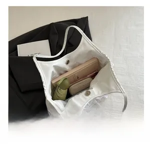 Internal view of a white lace tote bag showing large capacity for daily items
