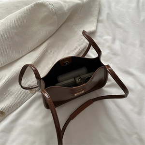 Vintage caramel brown shiny PU leather bucket bag with top handles and shoulder strap