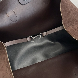Retro matte brown tote bag showing internal lobster clasp and premium suede lining