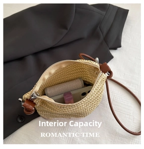 Detail view of woven straw bucket bag showing interior capacity for phone and cosmetics