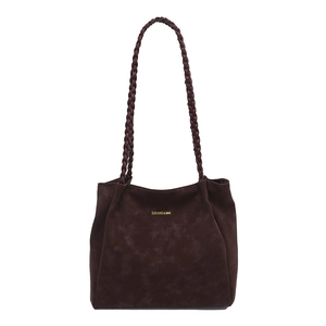 Retro dark brown suede shoulder bag with woven strap and gold logo on white background