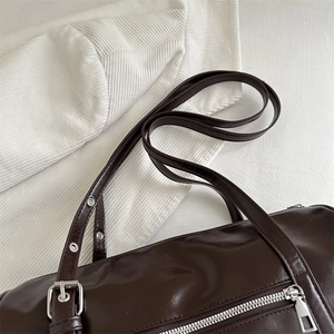 Vintage brown oiled leather Boston bag with silver hardware and adjustable eyelet strap