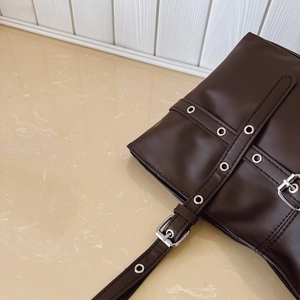 Retro dark brown wax leather tote bag with silver eyelets and buckle details for women