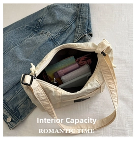 Spacious interior of off-white canvas bag showing wallet and phone storage