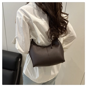 Deep brown half-moon underarm bag with decorative stitching on high-quality PU leather