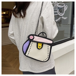 Detail of 2D cartoon style crossbody bag with black chain strap on a female model