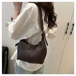 Detail of soft dark brown leather hobo bag with adjustable strap for daily commute