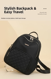 Detailed macro view of black quilted nylon backpack with gold-tone zippers and elegant texture